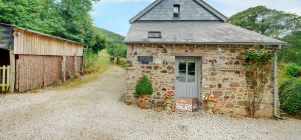 a cottage with cookaway on holiday recipe box on the doorstep